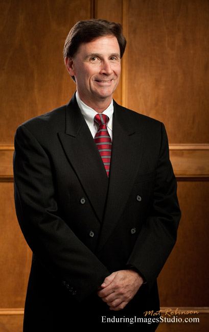 Environmental portrait - executive in front of wood paneling, Denville, Morris County